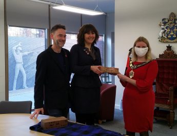 New Mayor Rachel Eden signs brick